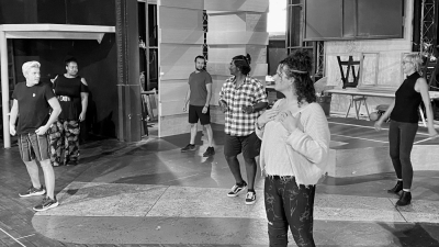 Cast members Michael Hernandez, Mack, Pedro Flores, Aathaven Tharmarajah, and Jae Weit warm up with director Cynthia Fleming (far right). Photo: Joshua Black